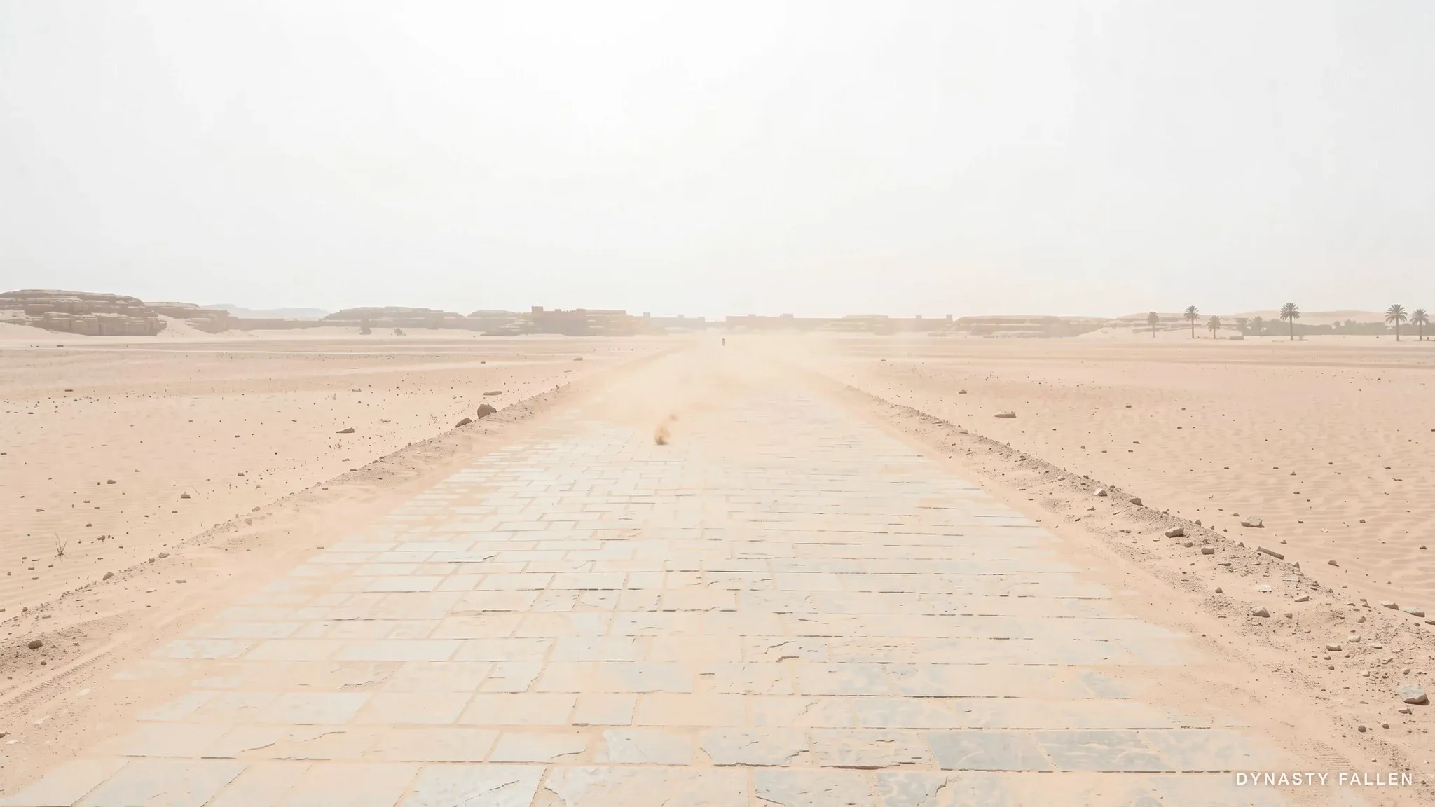 The Roman road runs ruler-straight across the desert, the column advancing.